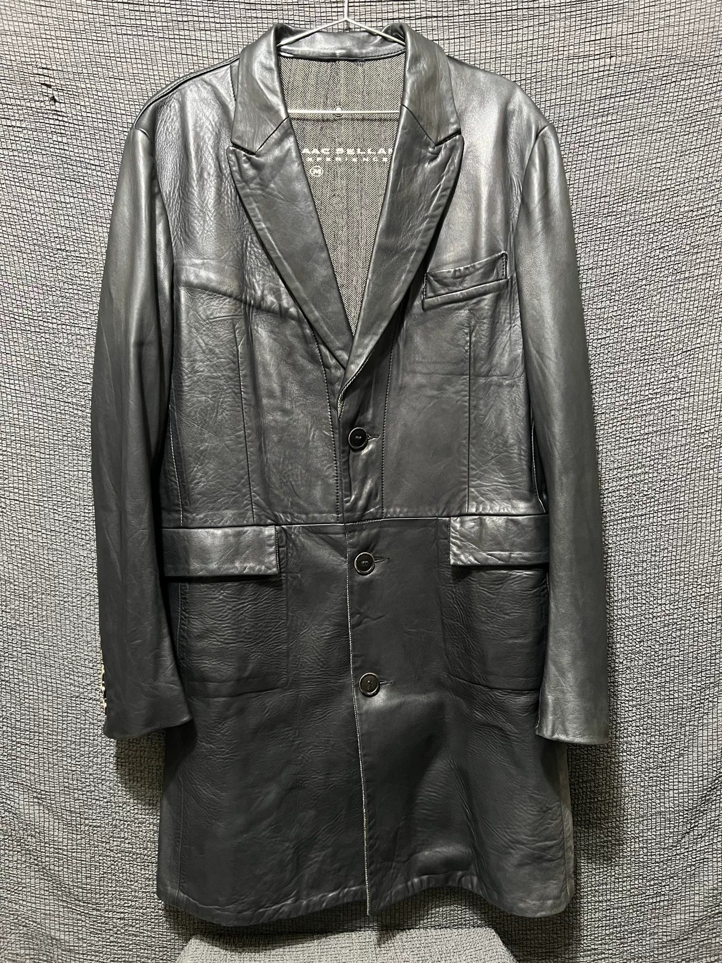 dark leather overcoat by isaac sellam experience