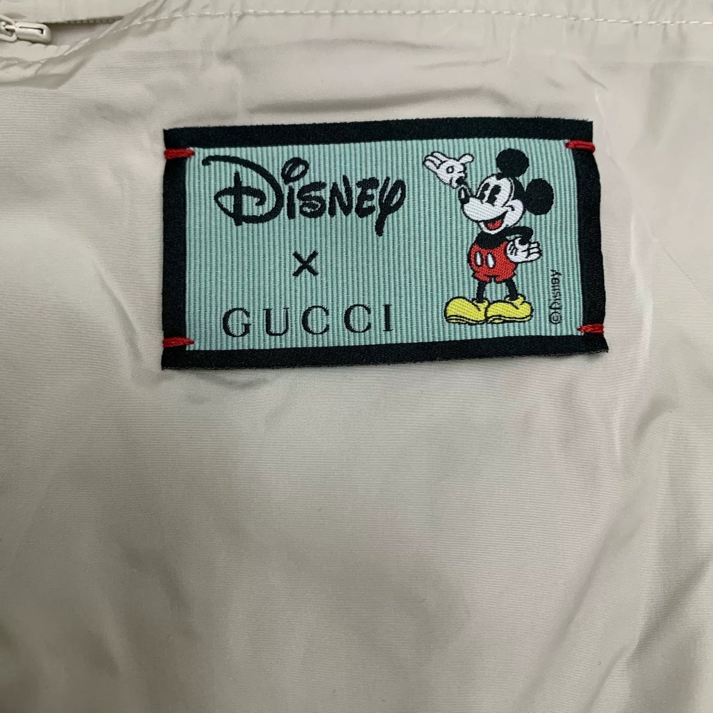 gucci x disney white reflective jacket