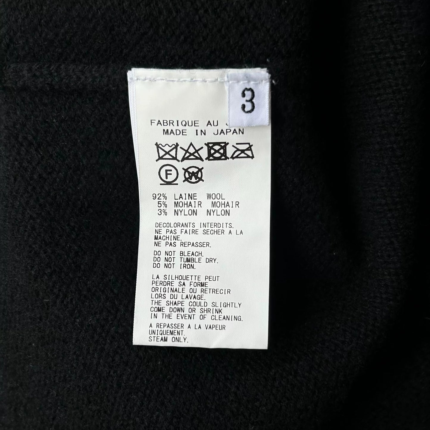 black sleeveless knit vest with floral design