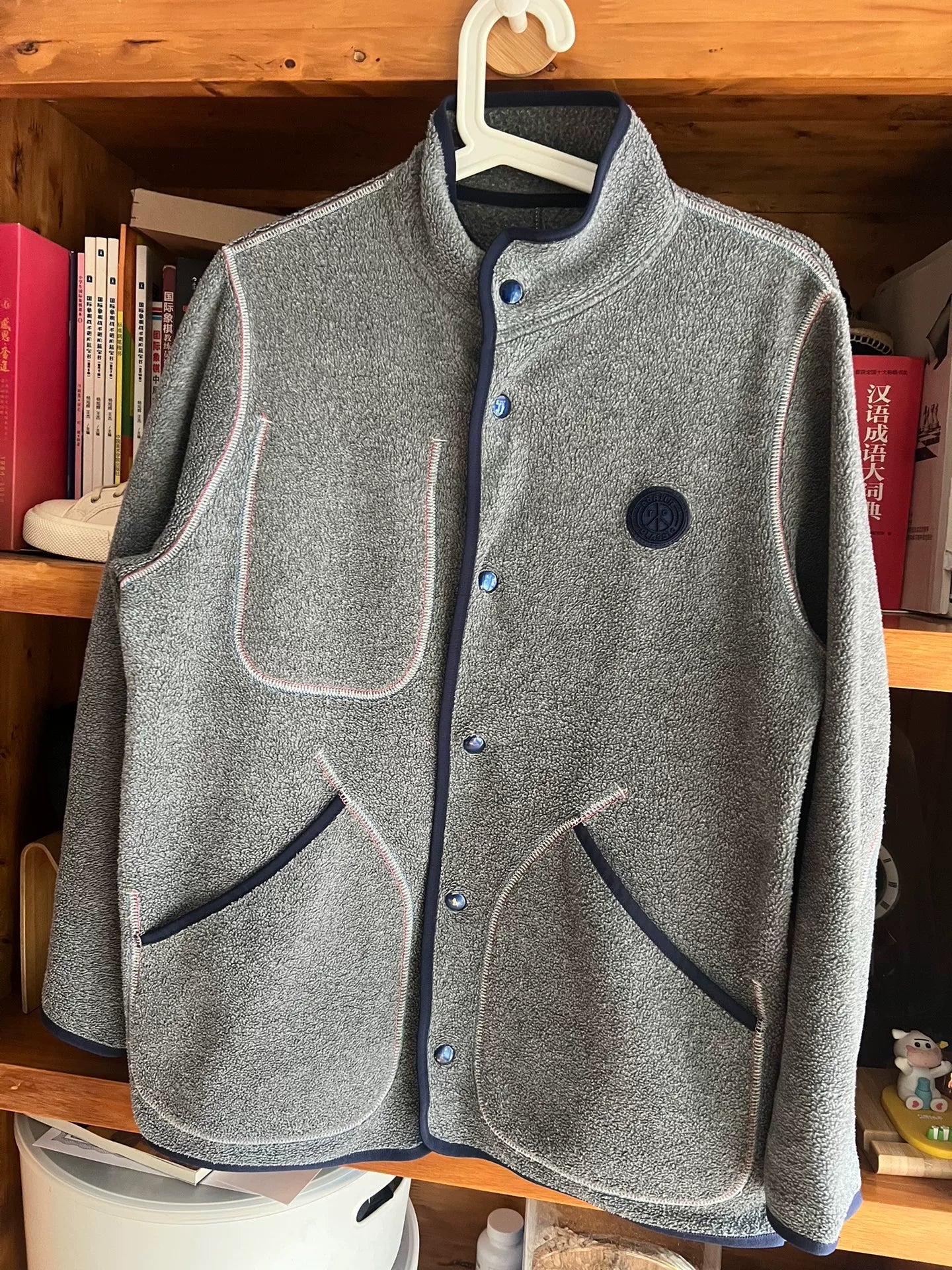 stylish gray fleece jacket with blue accents