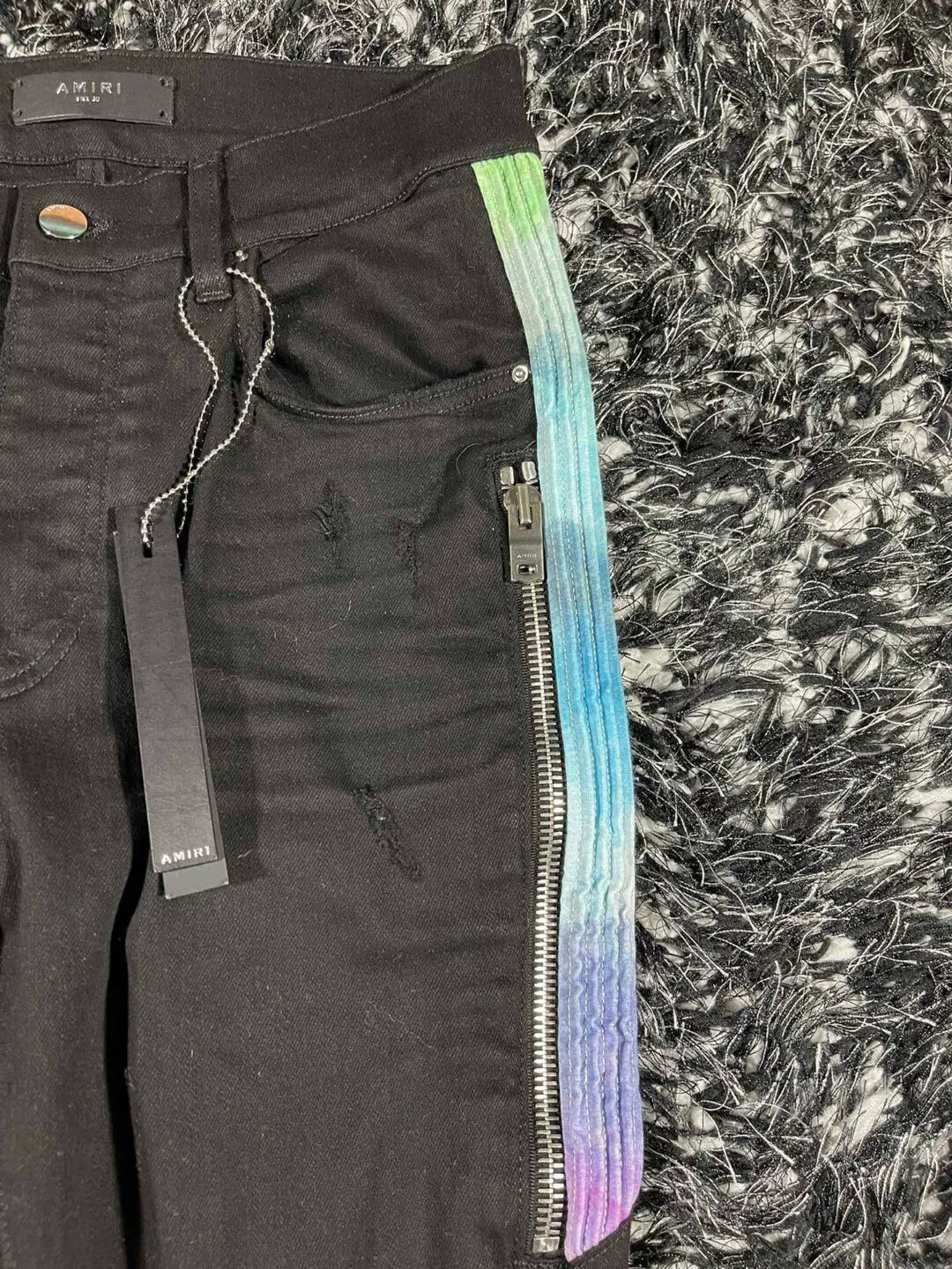 amiri watercolor half track jean