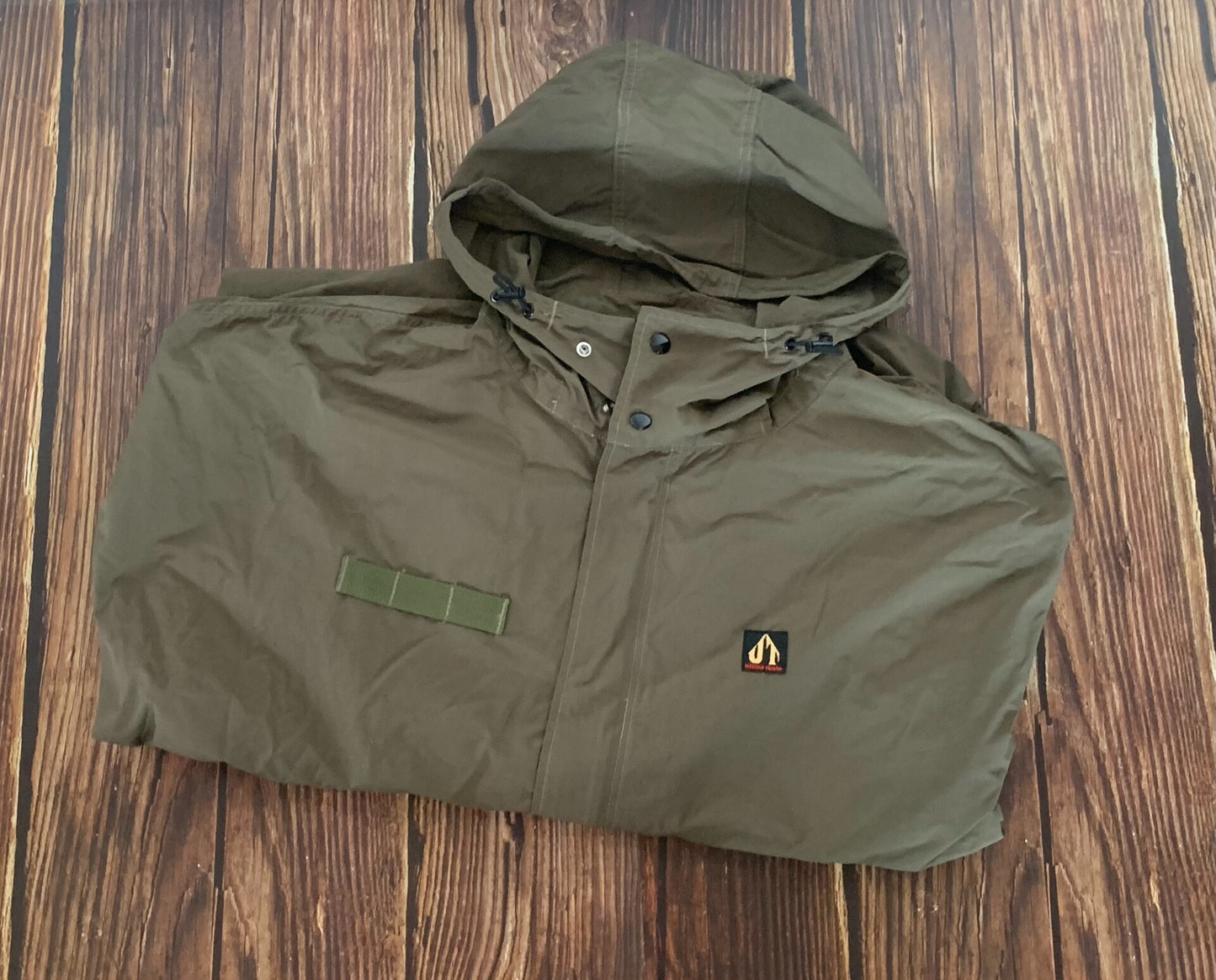 tactical raincoat for outdoor adventure in green