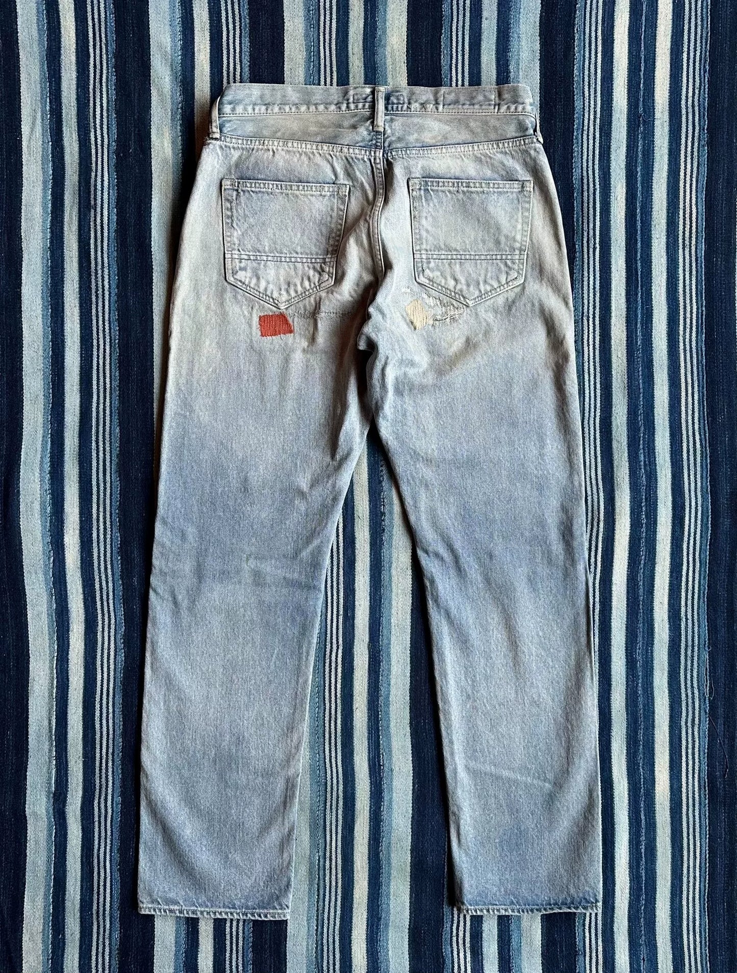 fdmtl slim fit denim distressed patchwork jeans