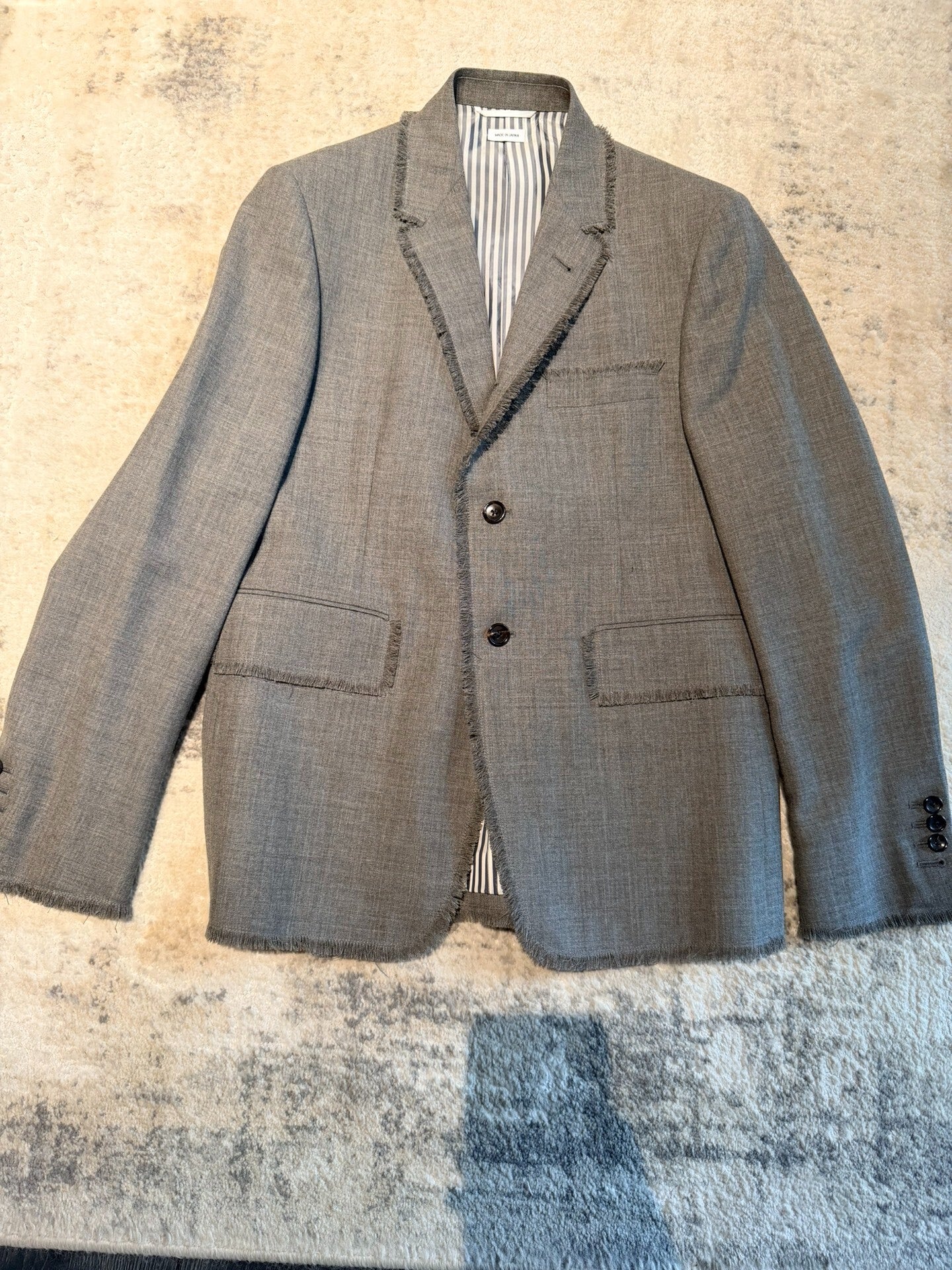 thom browne classic gray blazer with frayed edges