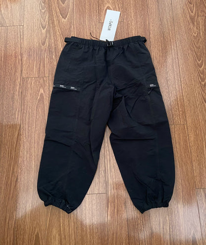 wtaps nylon track trousers in black