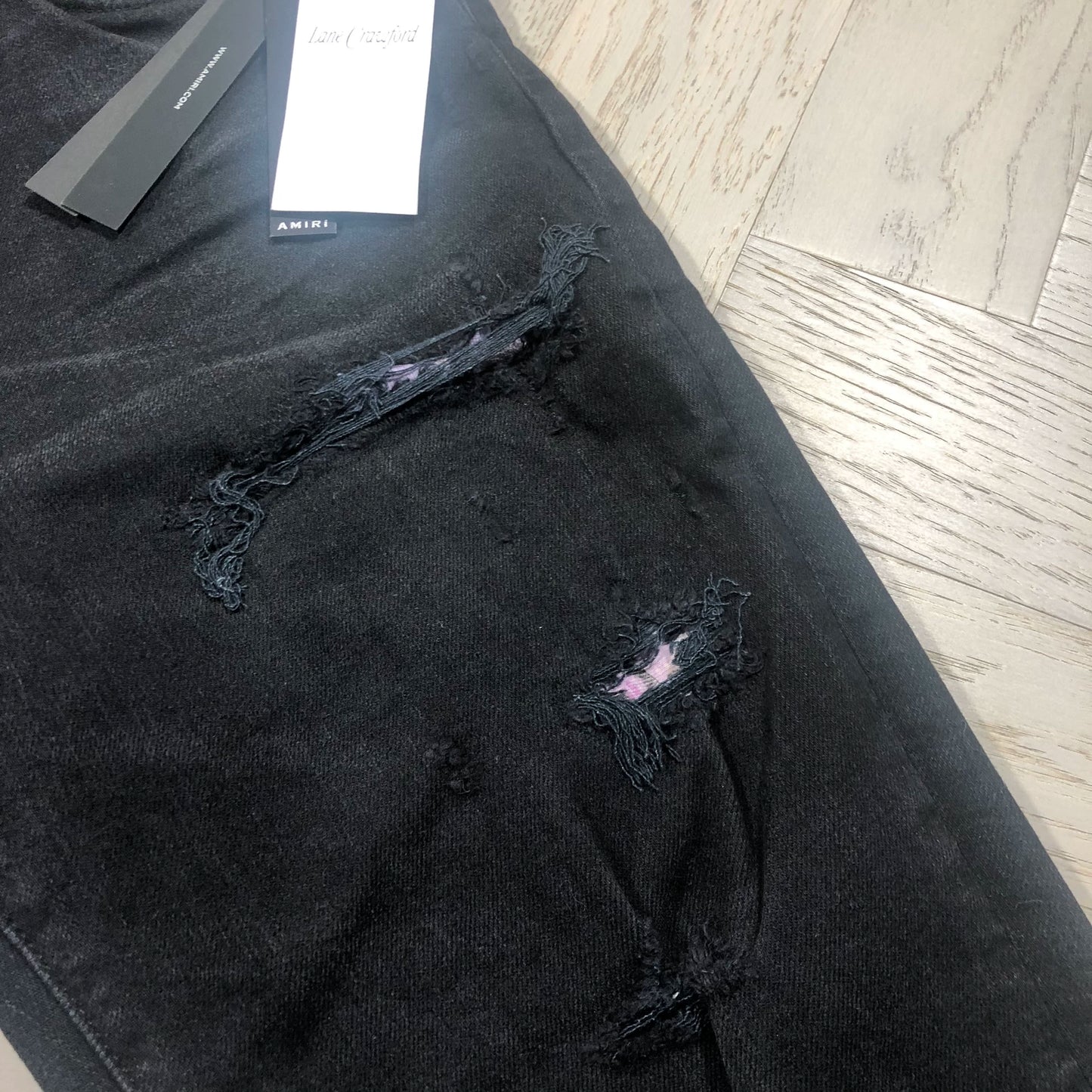 AMIRI Black Distressed Jeans with Floral Lining