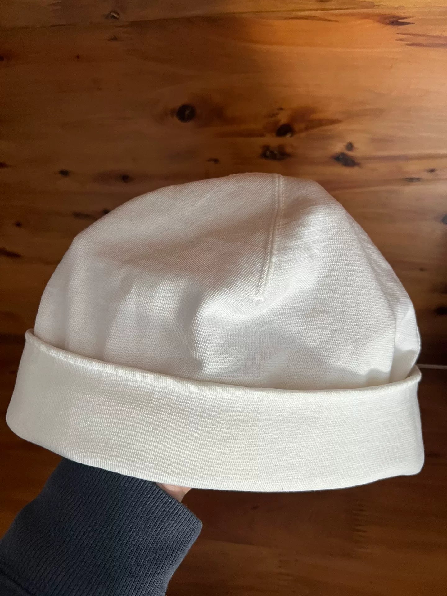 white knitted beanie with logo