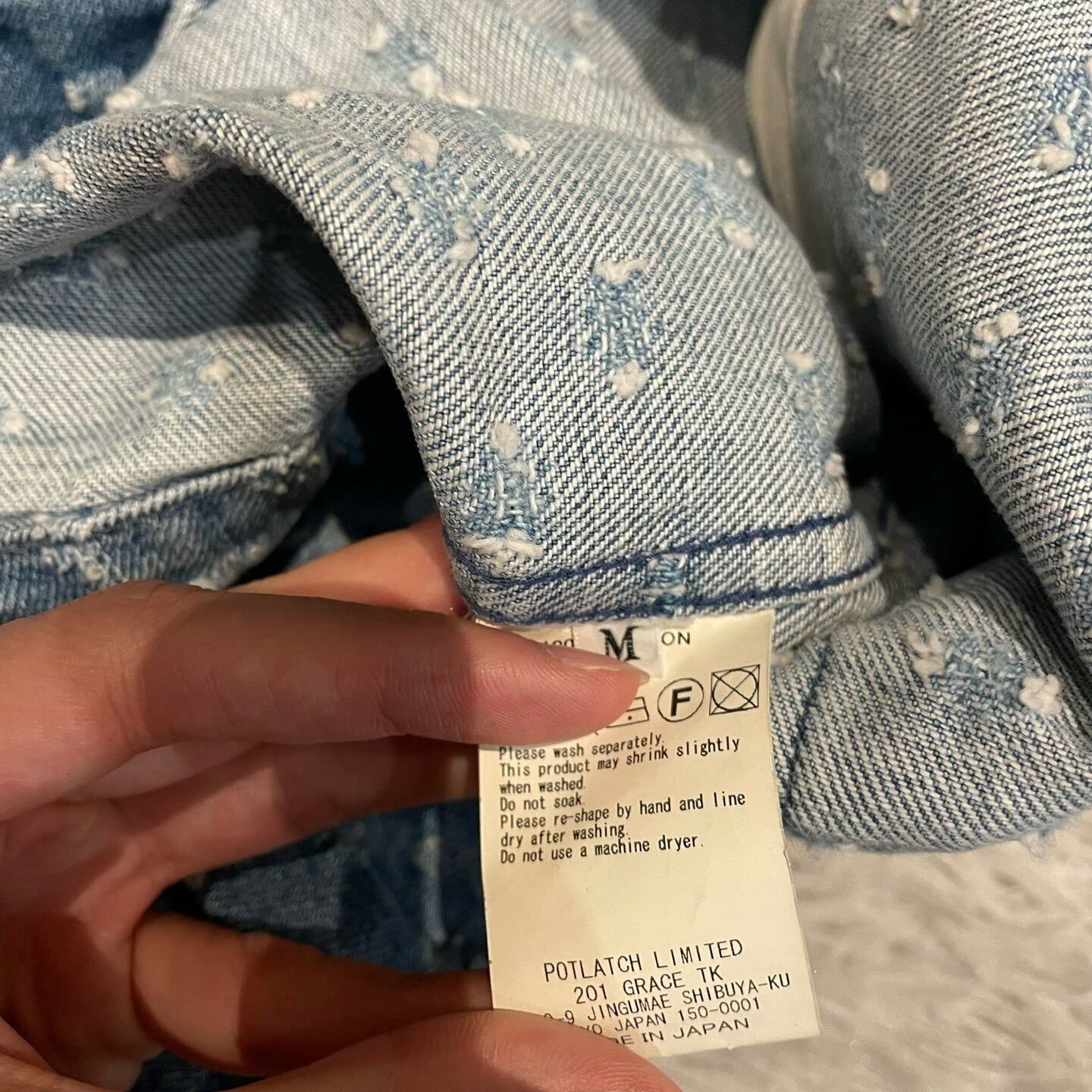 CE/CAVEMPT Distressed Denim Jacket