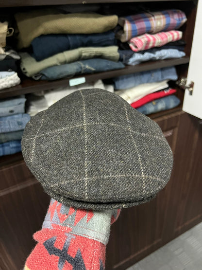 gray newsboy cap with plaid pattern