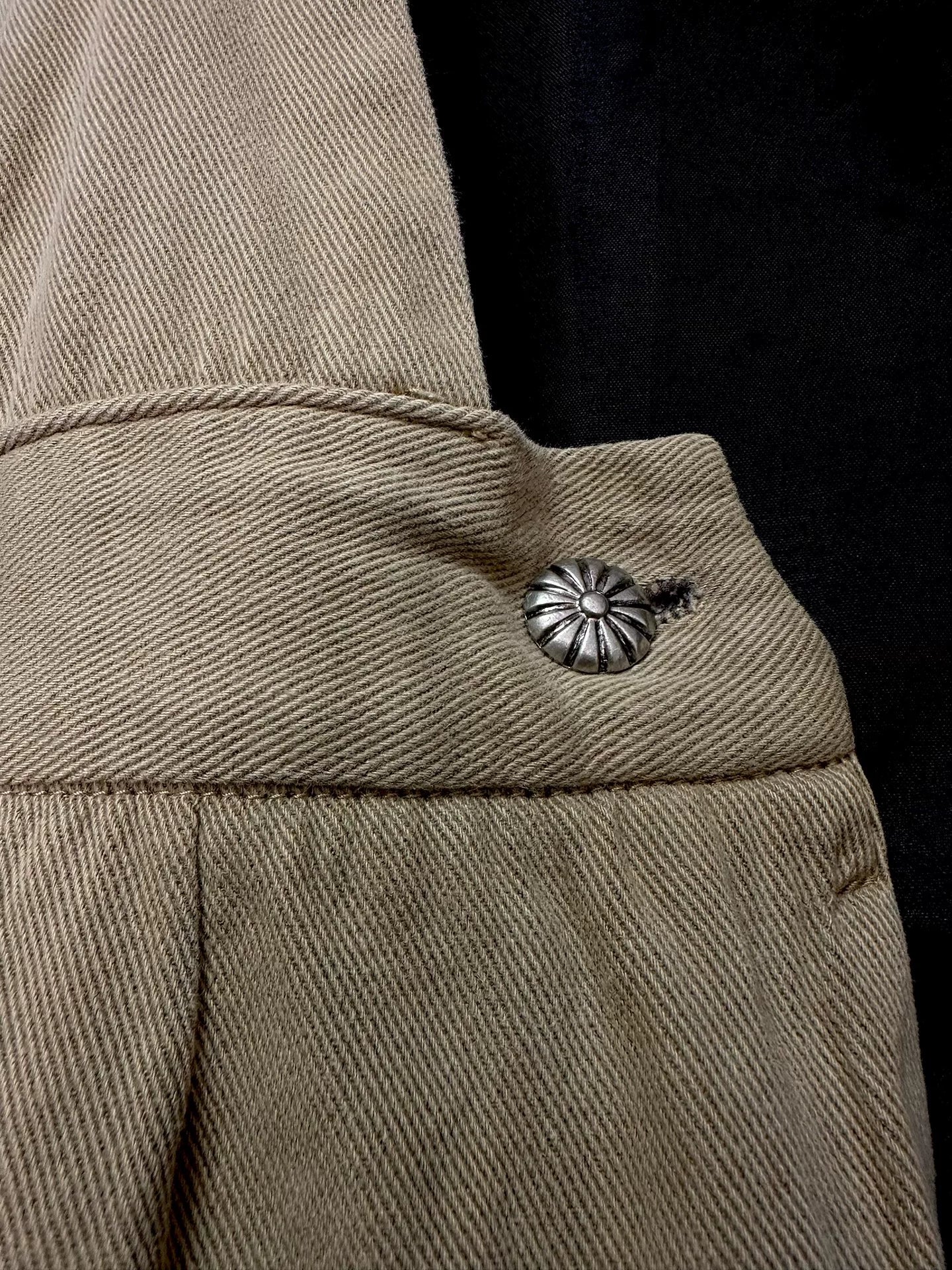 beige velvet overalls with silver buckles