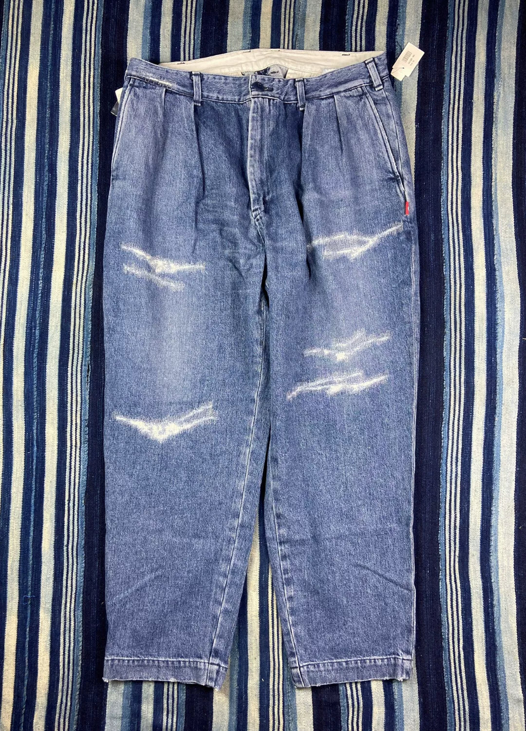 washed blue tapered denim pants for men