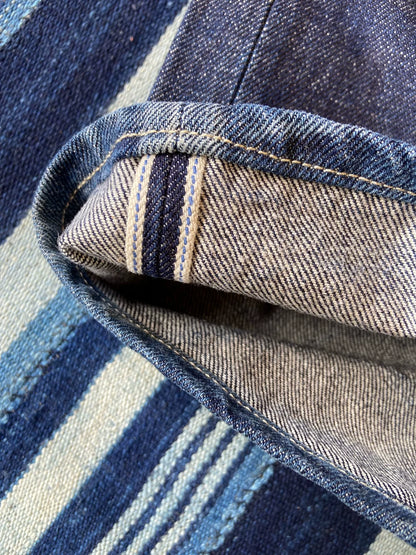 washed vintage-style raw denim jeans