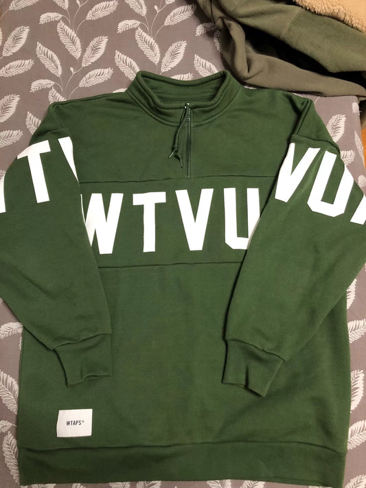 wtaps green pullover sweatshirt with text
