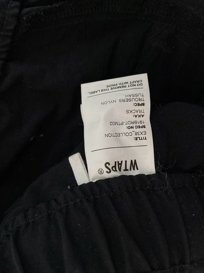 wtaps nylon track trousers in black