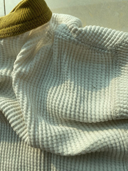 white and gold long sleeve graphic shirt