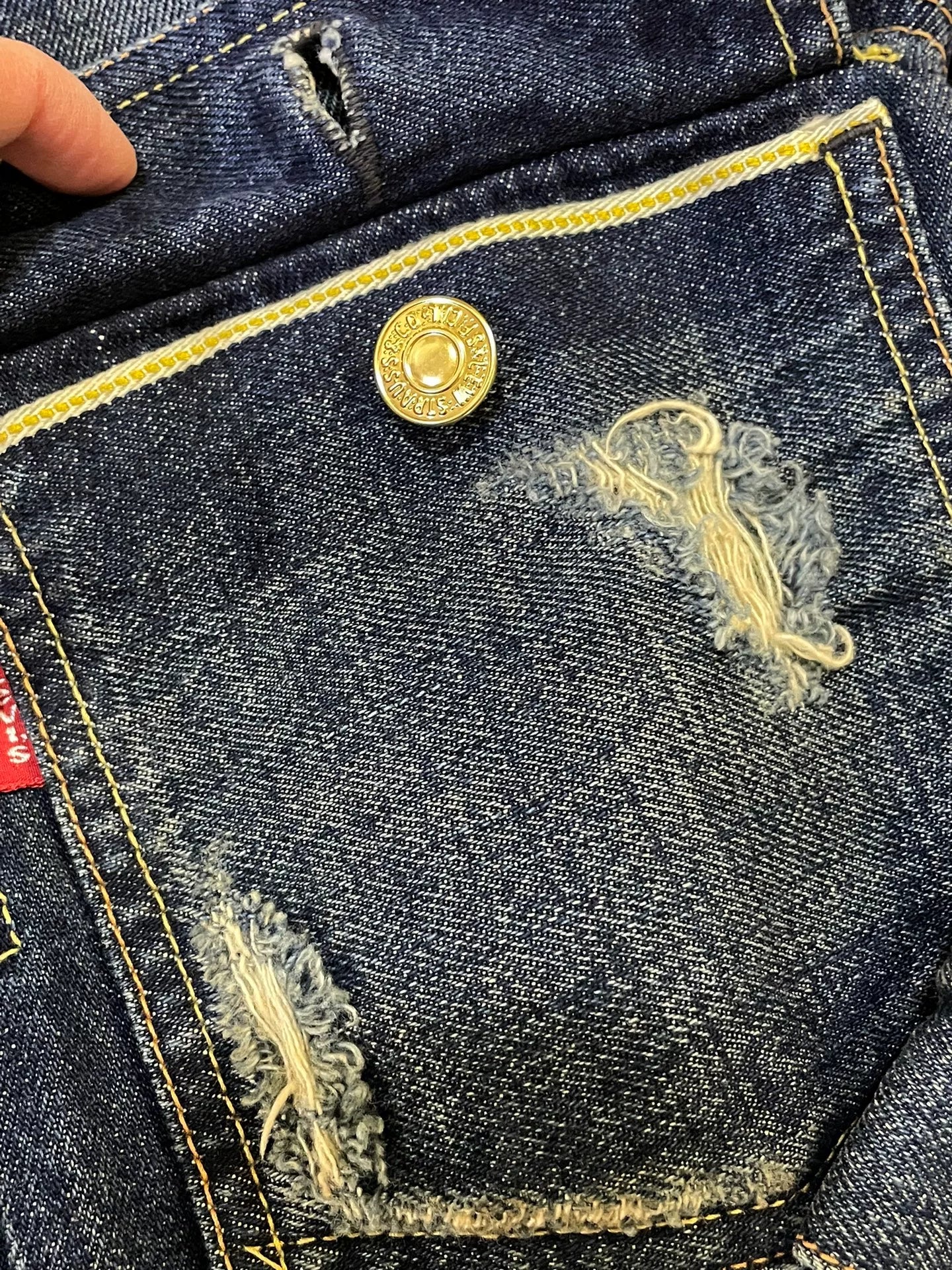 stylish blue denim jacket with gold buttons