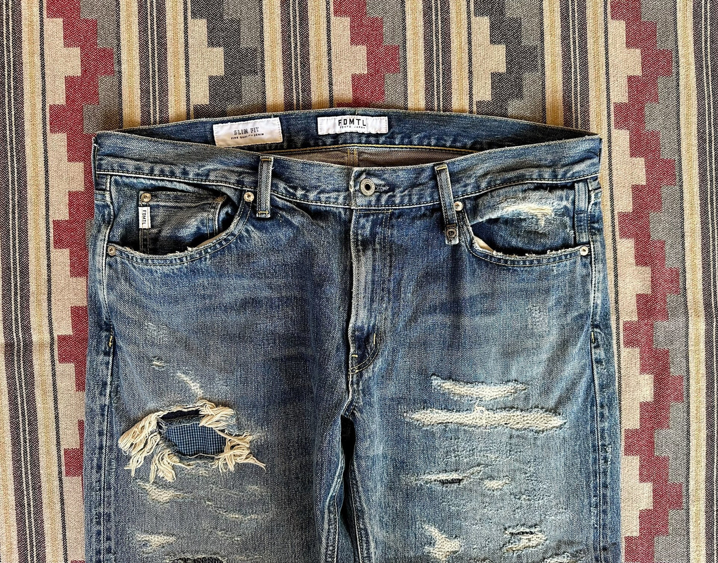 fdmtl slim fit denim distressed jeans