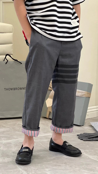 gray striped wool suit trousers by Thom Browne