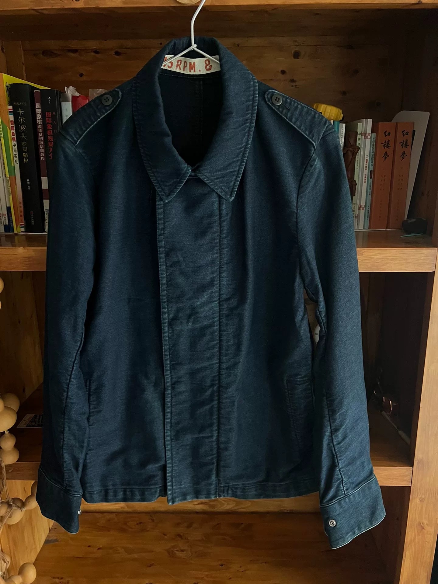 blue dyed motorcycle jacket with subtle vintage touch
