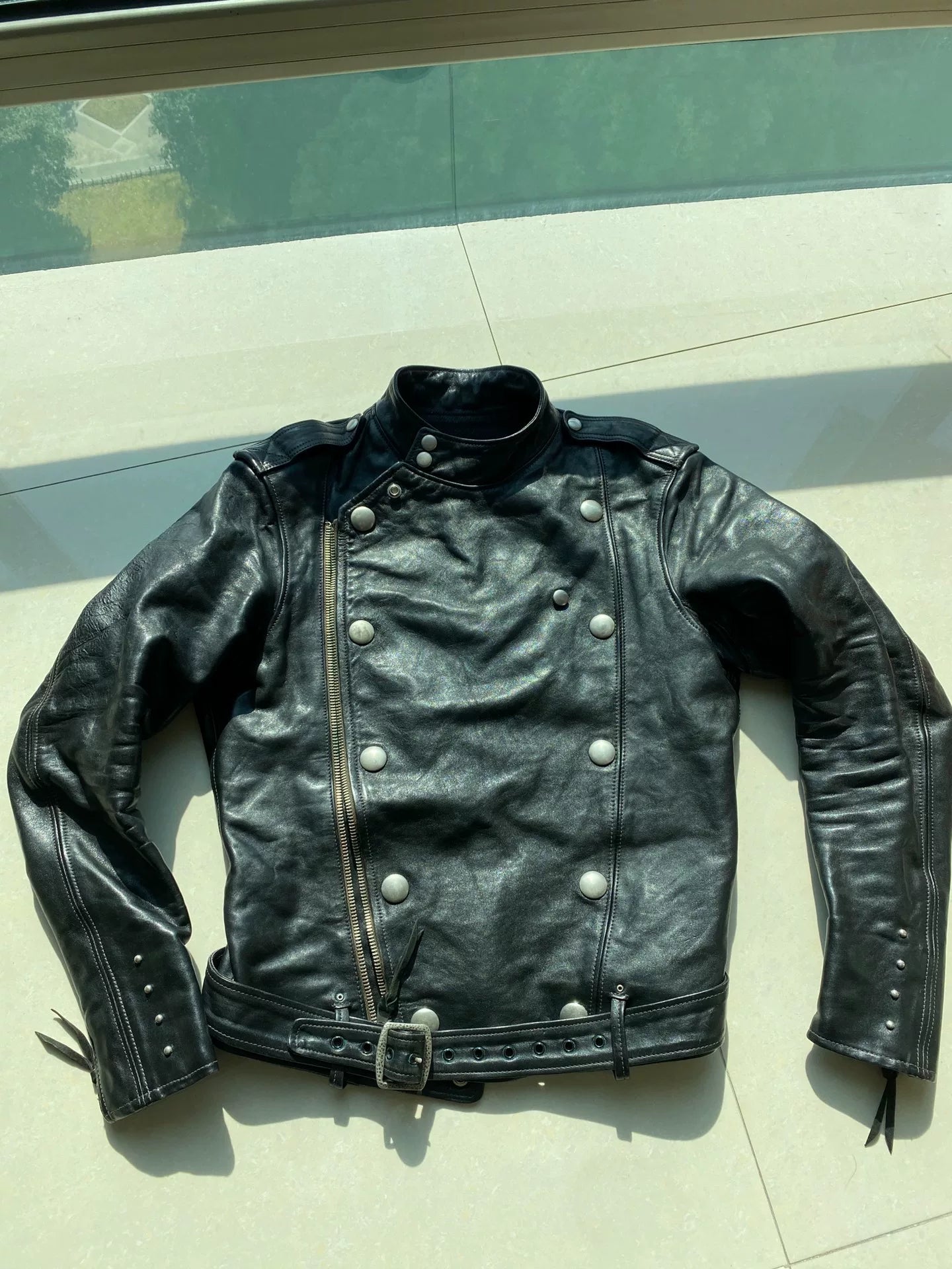 black leather biker jacket with detailed embellishments