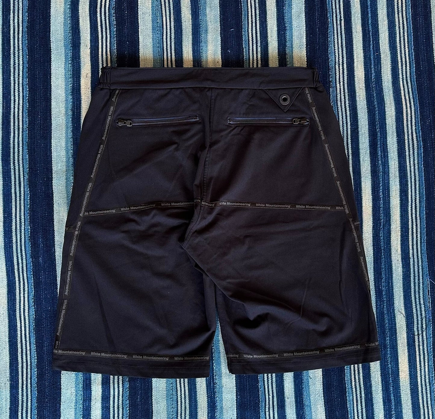 white mountaineering functional shorts with quick-dry fabric
