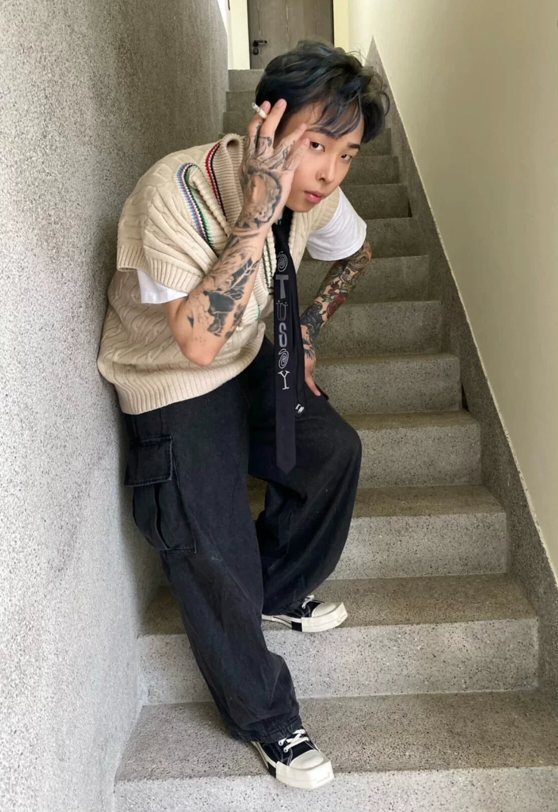 asymmetric knitted vest with multiple collars