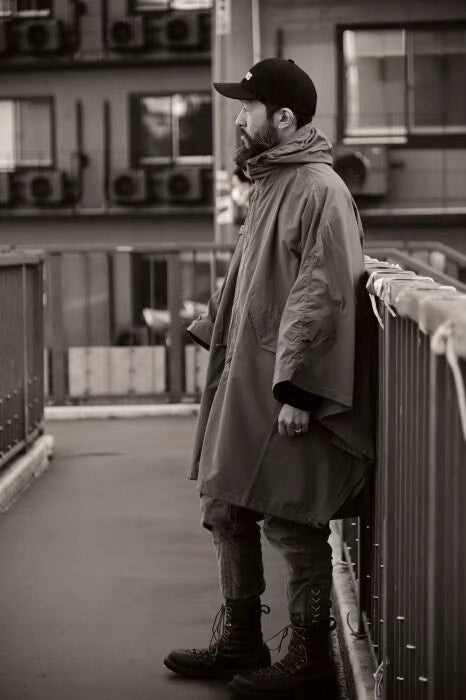 tactical raincoat for outdoor adventure in green