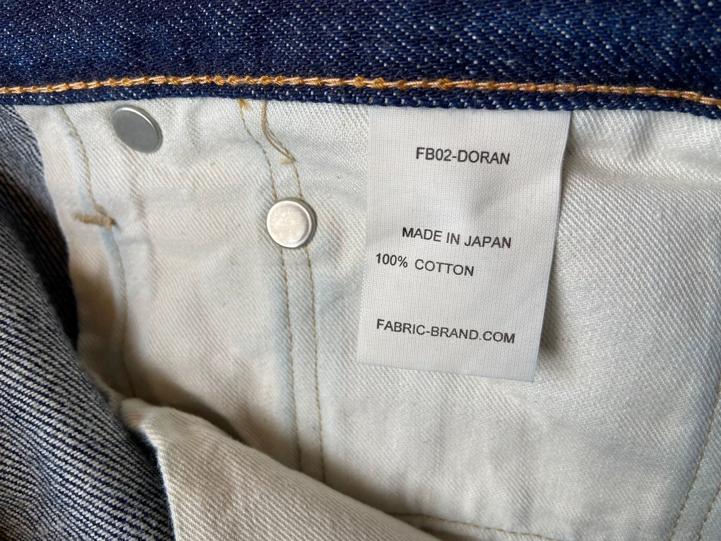 washed vintage-style raw denim jeans