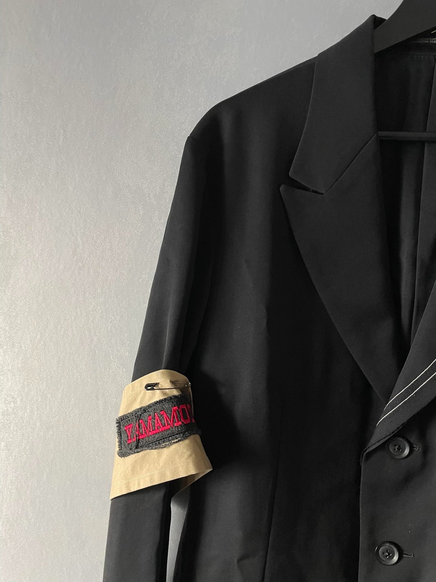 asymmetrical jacket with sleeve patch by yohji yamamoto