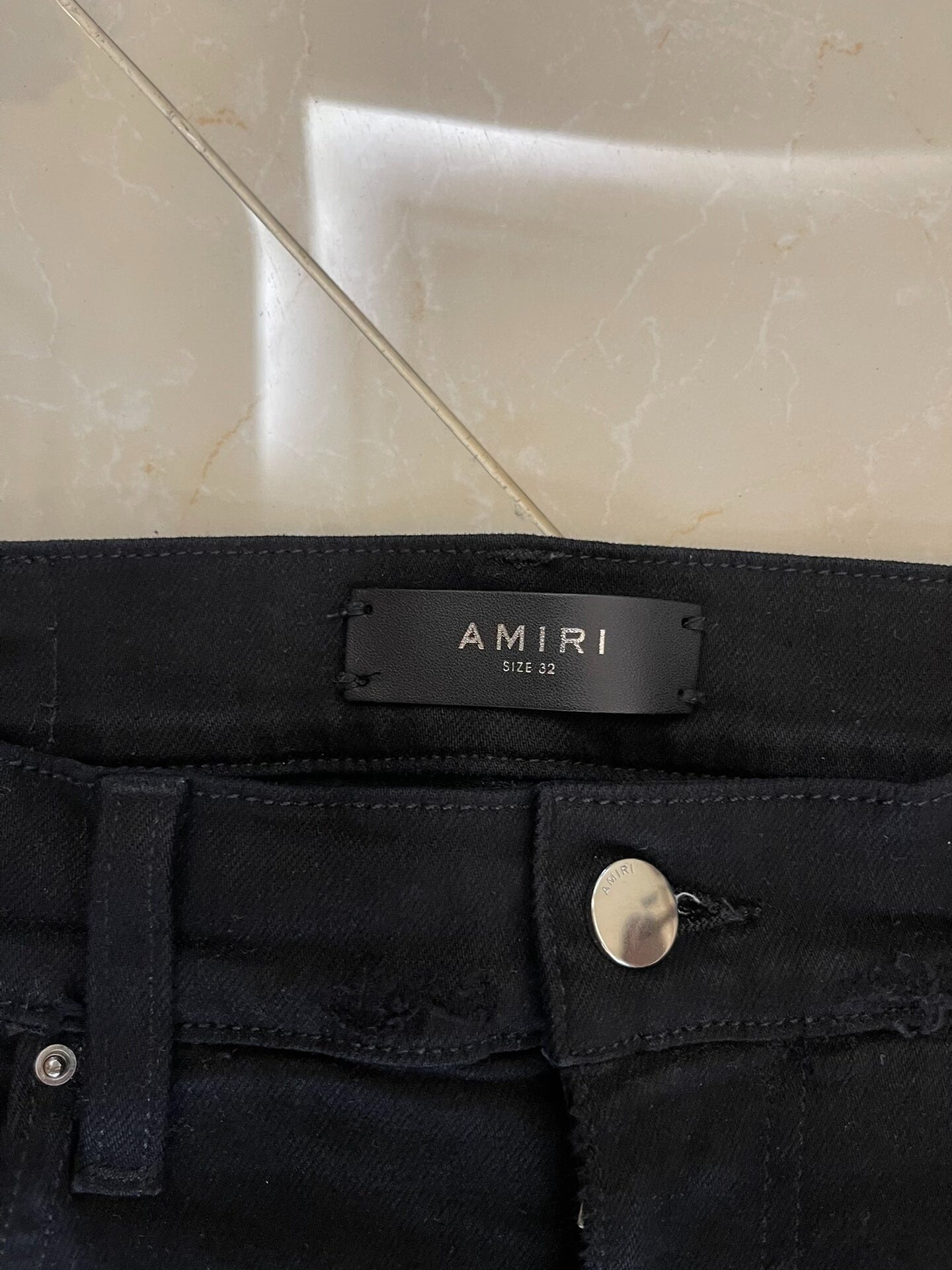 Amiri Black Denim Pants with Artistic Features