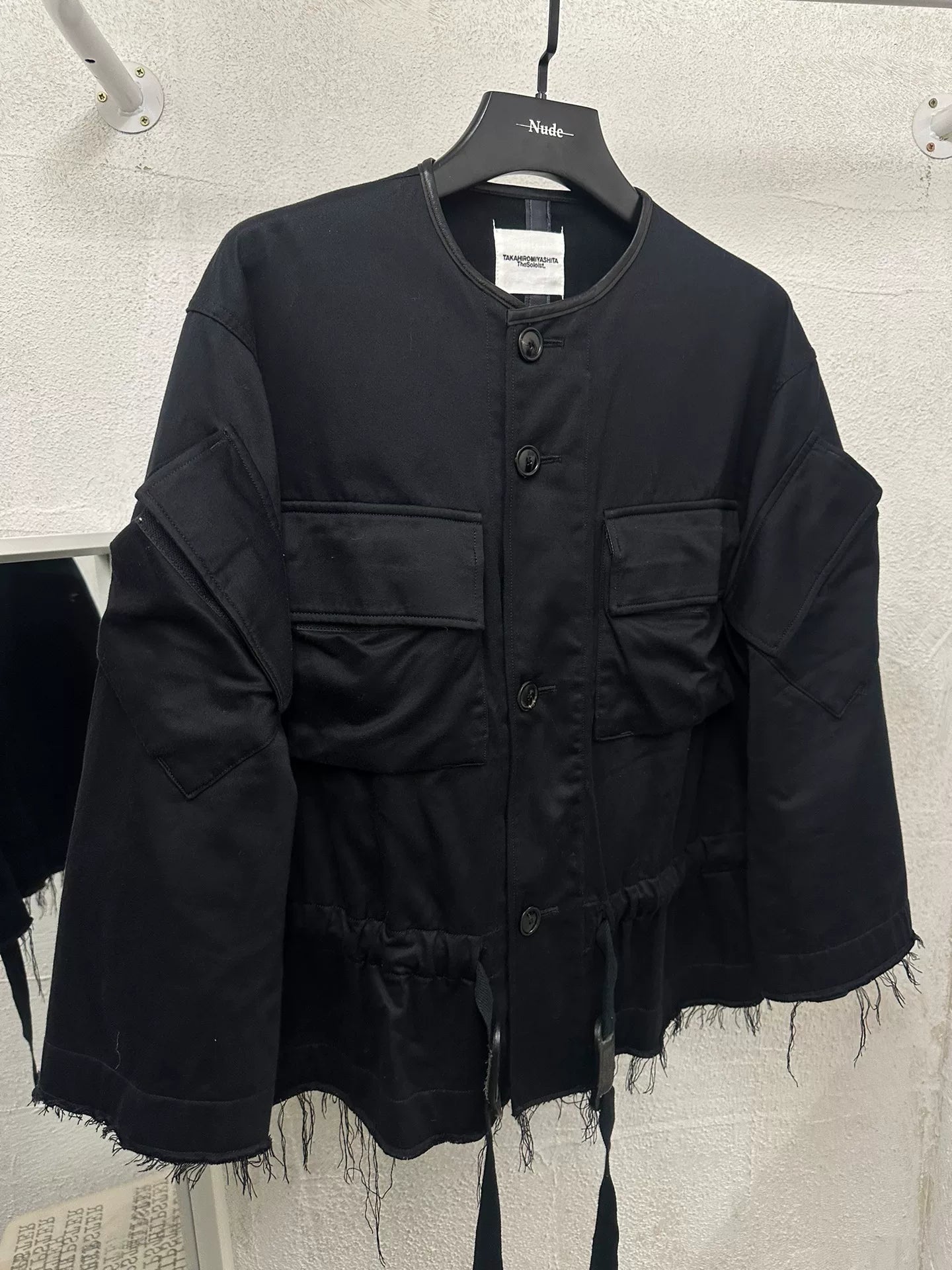 black oversized jacket with frayed hem