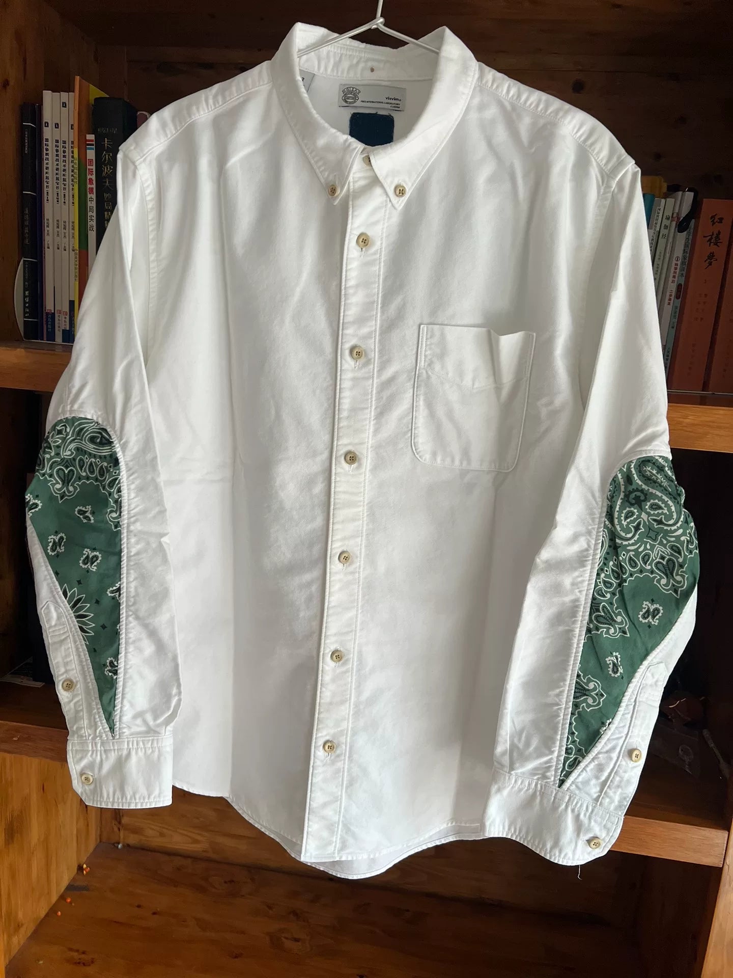 white drop sleeve shirt with paisley design