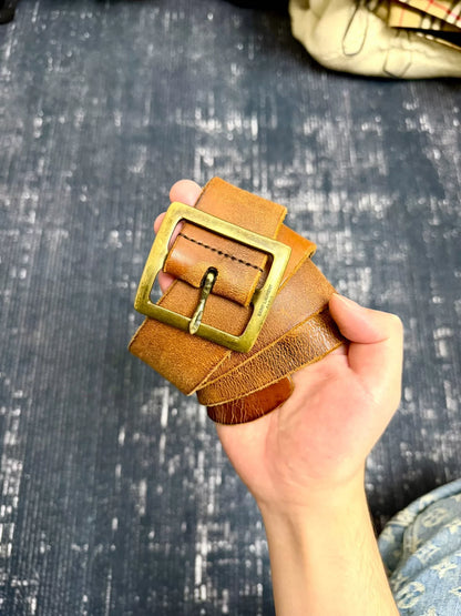 brown leather belt with gold buckle