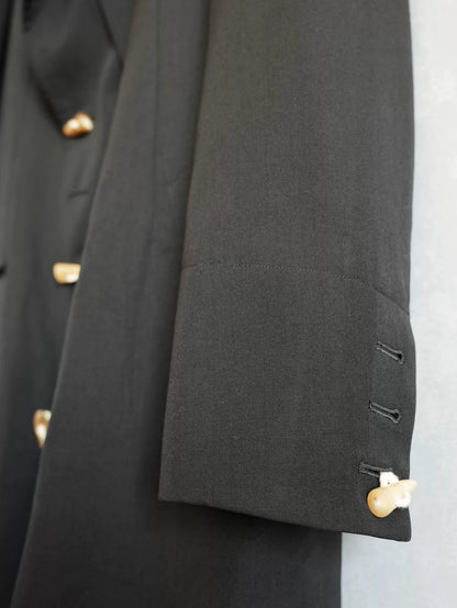 black double-breasted horn-button coat