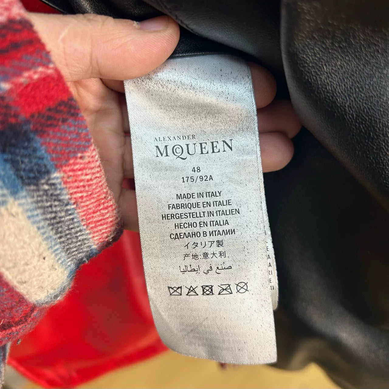 black leather down jacket with red accents