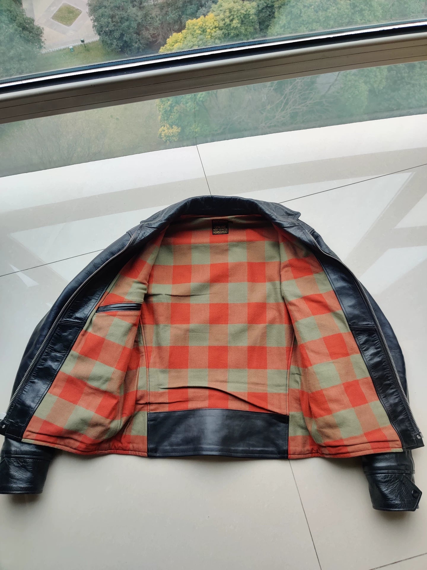 black leather jacket with snowflake pattern