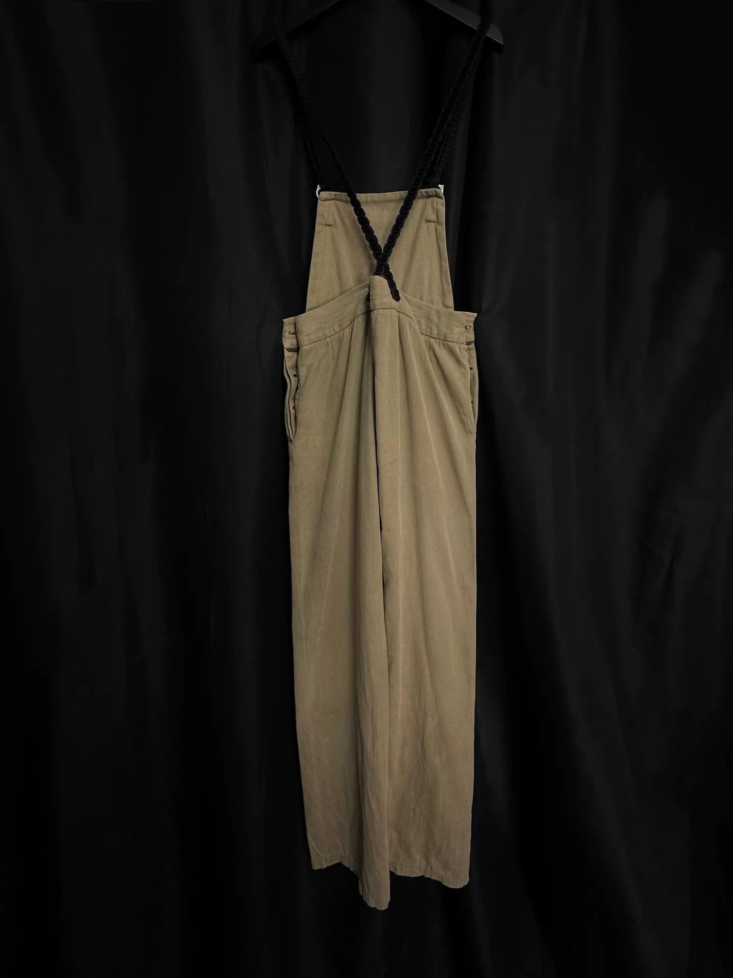 beige velvet overalls with silver buckles