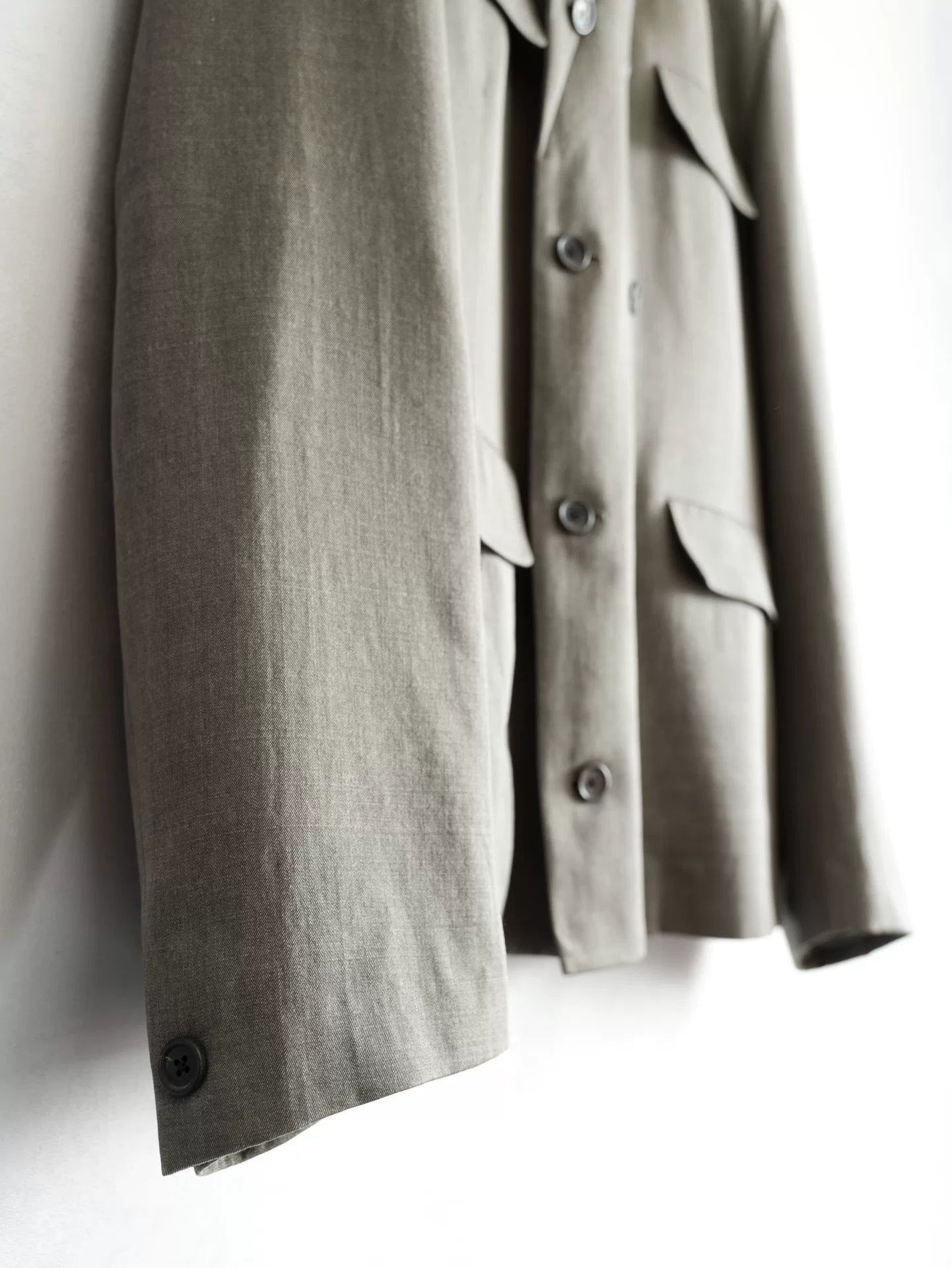 double-breasted concrete gray jacket