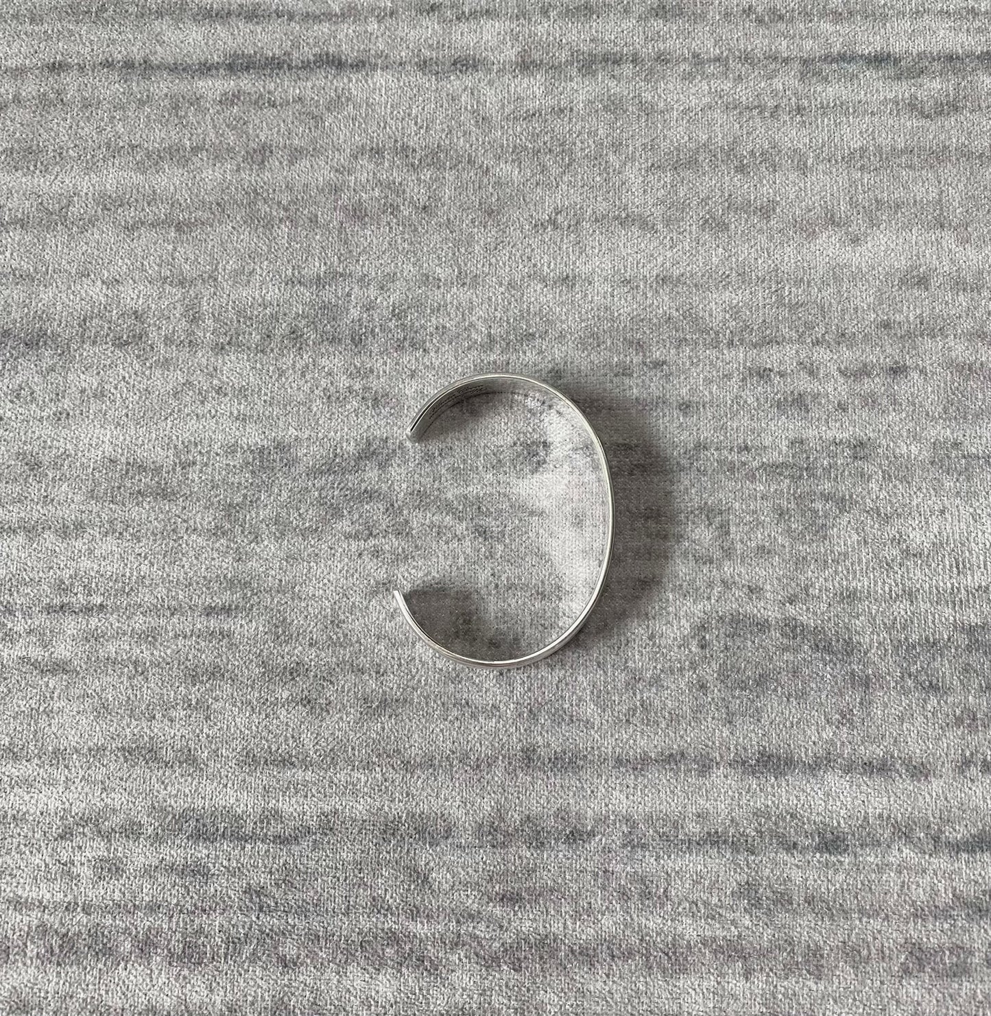 silver adjustable bracelet with teeth design