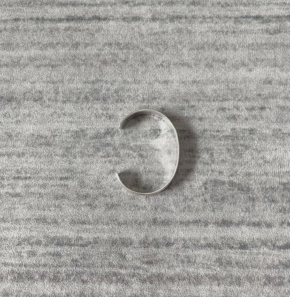 silver adjustable bracelet with teeth design