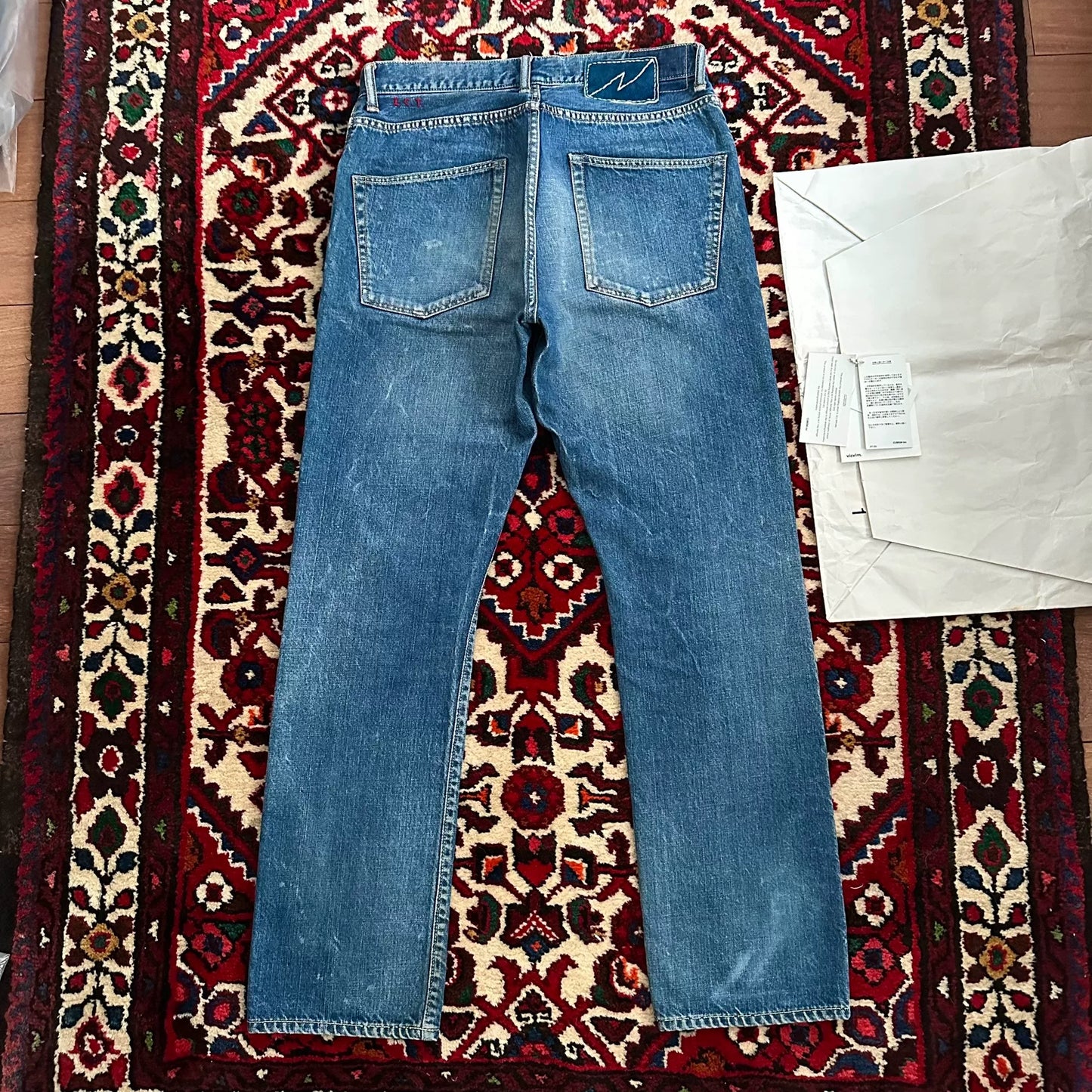 visvim mud-dyed wide-leg denim pants