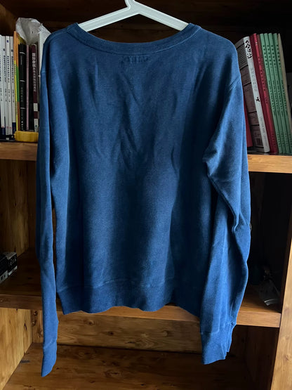 blue denim wash sweatshirt with text