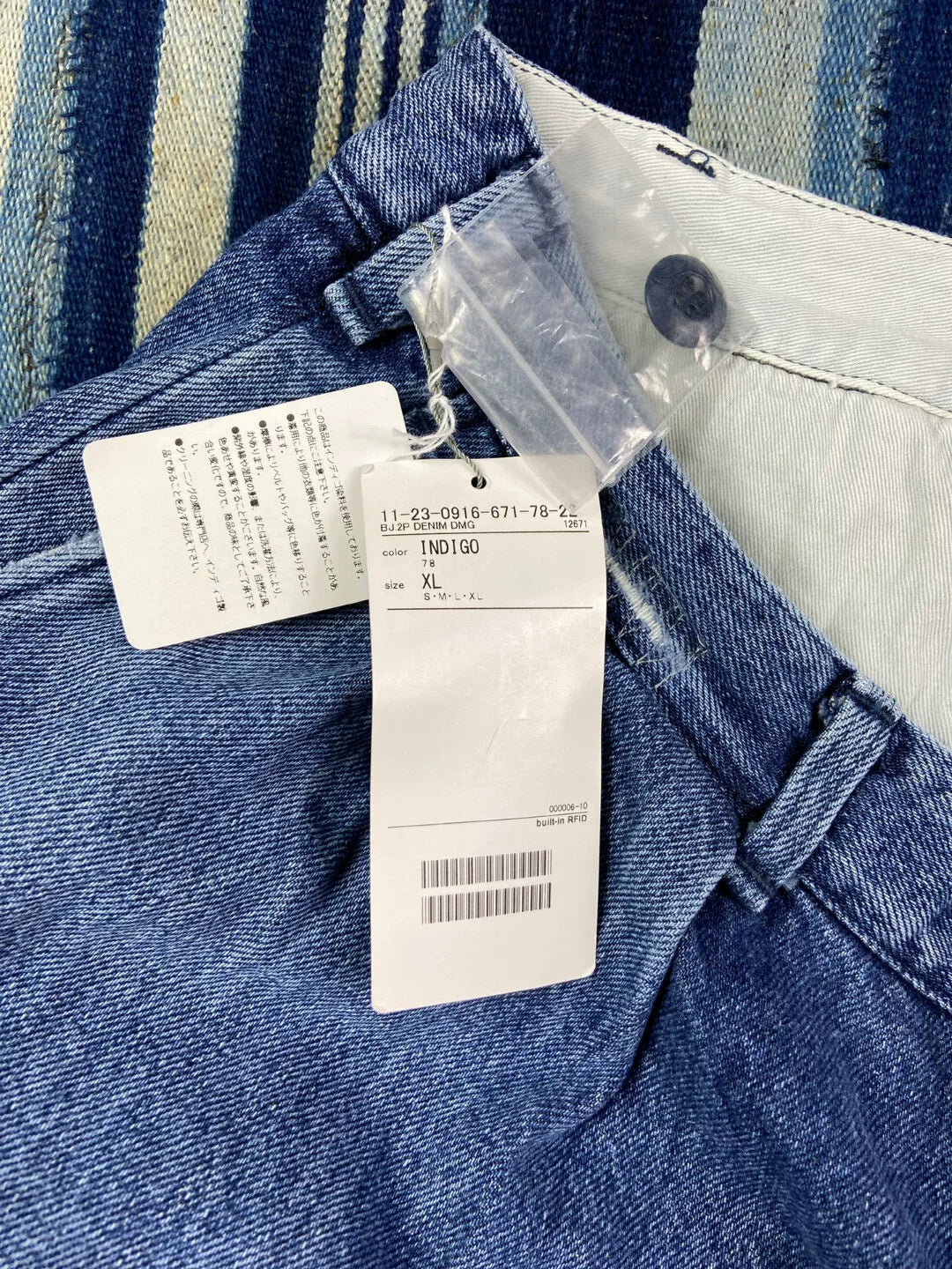 washed blue tapered denim pants for men