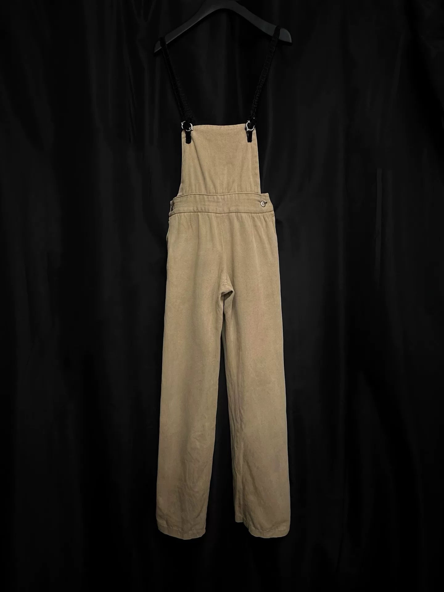 beige velvet overalls with silver buckles