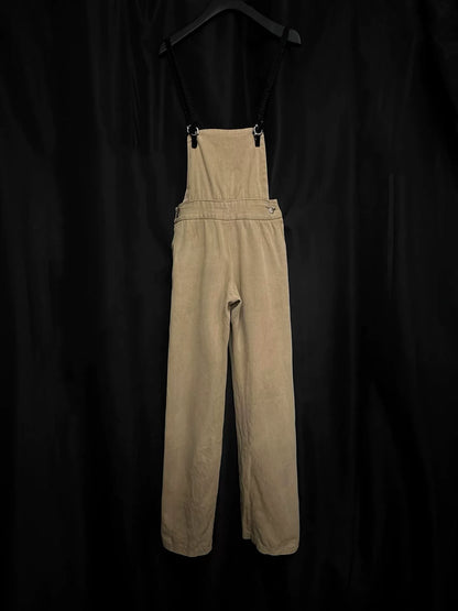 beige velvet overalls with silver buckles