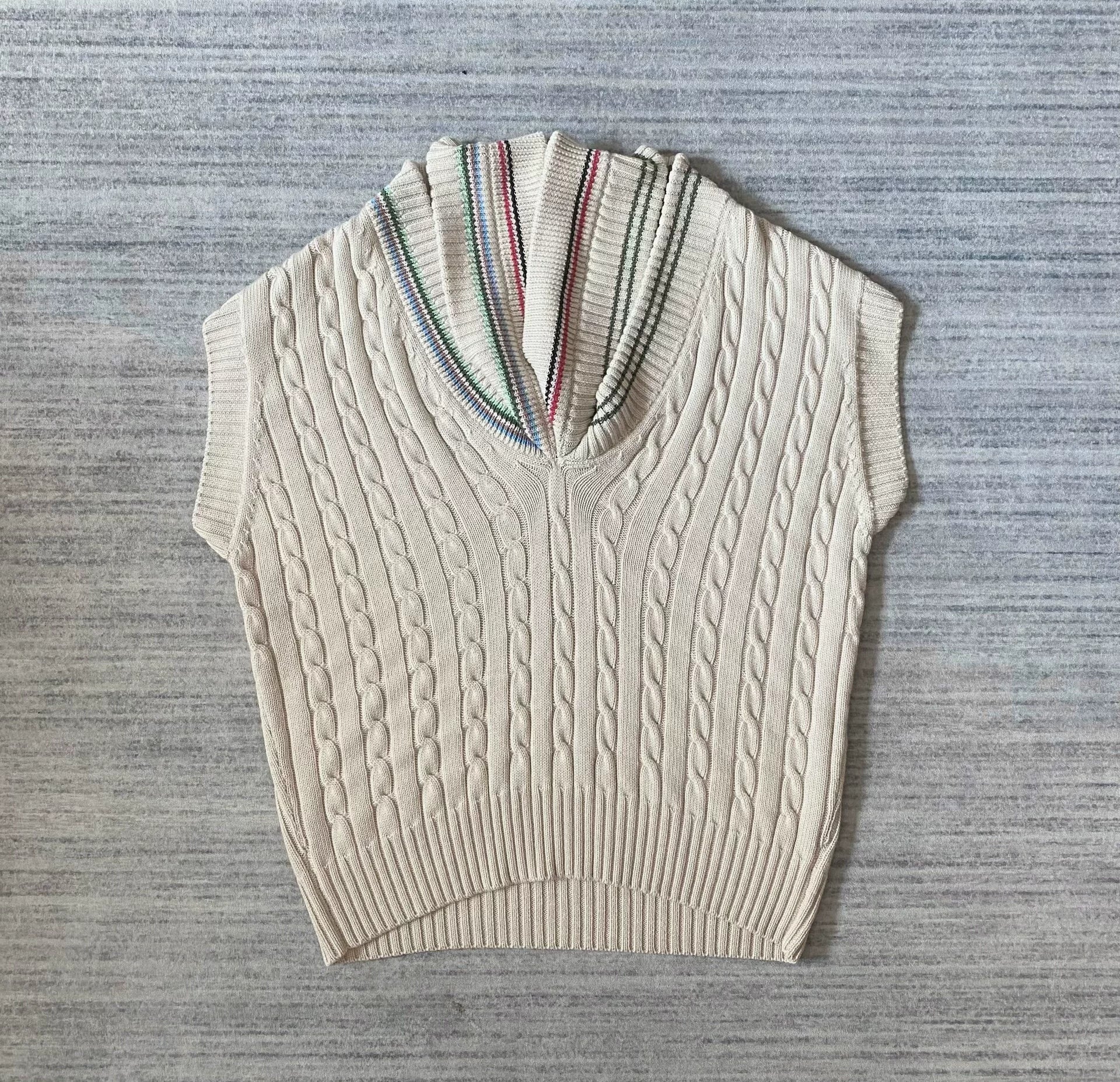 asymmetric knitted vest with multiple collars