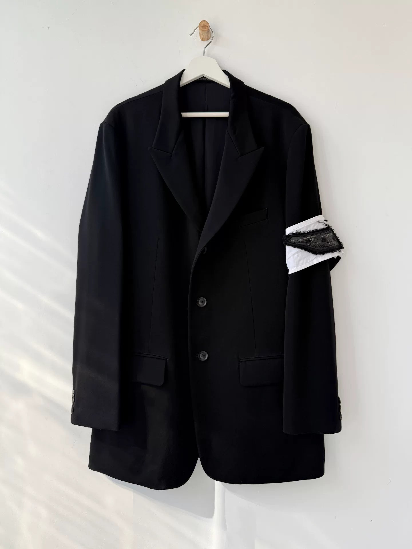 black wool suit jacket with white detail