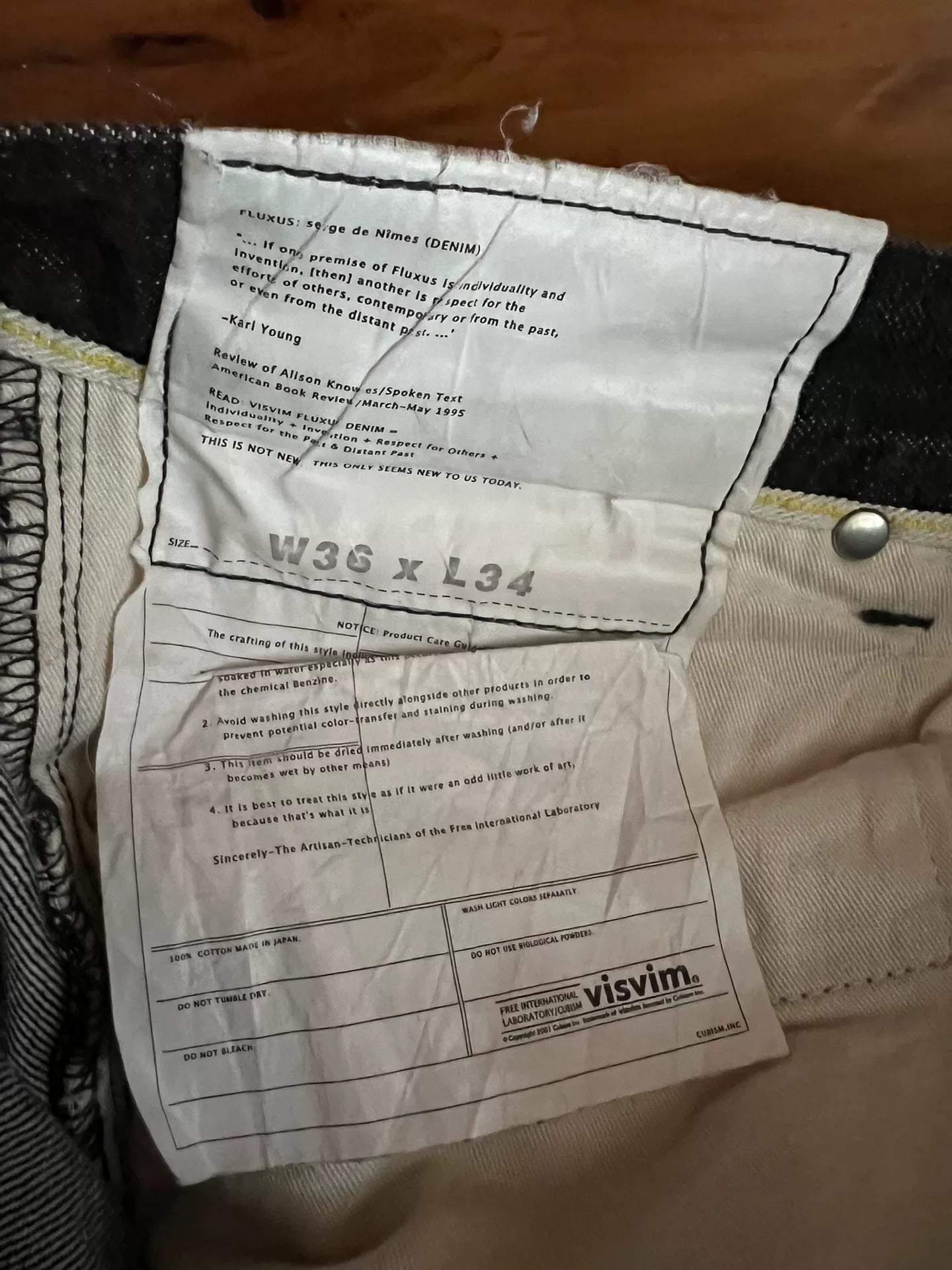 visvim black denim pants with colorful details