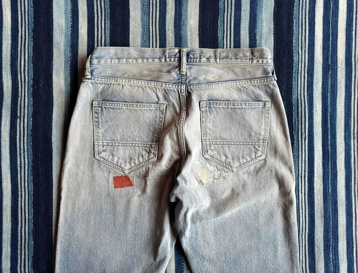 fdmtl slim fit denim distressed patchwork jeans