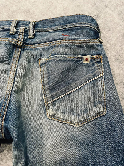 distressed low-rise blue denim jeans